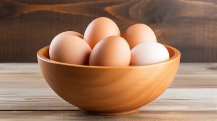 brown eggs on bowl on table
