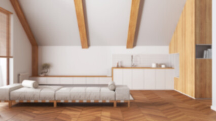 Blurred background, minimal wooden kitchen and living room with sloping ceiling. Fabric sofa and cabinets. Japandi scandinavian style, attic interior design
