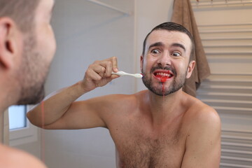 Brutal man with bleeding gums 