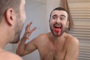 Scared man with bloody mouth  © ajr_images