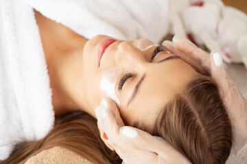 Fototapeta na wymiar Woman getting spa massage treatment at beauty spa salon