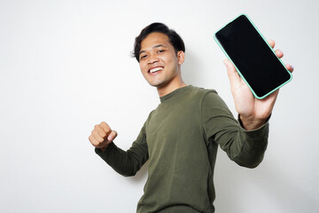 Adult Asian man excited while showing blank mobile phone screen