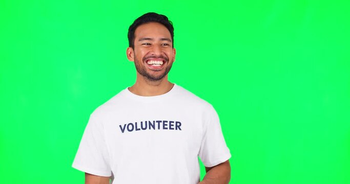 Face, funny volunteer and man on green screen in studio isolated on a background mockup space. Portrait, happy and Asian person for charity laughing at comedy, joke or humor for community service.