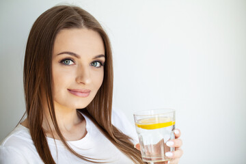 Woman Drinking Summer Refreshing Fruit Flavored Infused Water With Fresh Organic Lemon