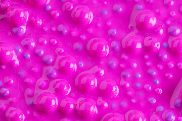 Balls in pink paint, abstract colorful background. Background with colorful balls in different sizes. Sphere of balls on pastel color.