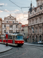Fototapeta na wymiar Prague, Czech Republic - 05 12 2023: Old red tram on the street of the old town in Prague.