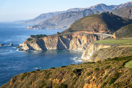 Majestic view of rocky coast of California and Bixby bridge on sunny autumn afternoon