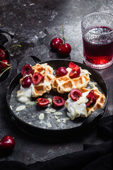 Fototapeta na wymiar Belgian sweet waffles with cream cheese and cherries
