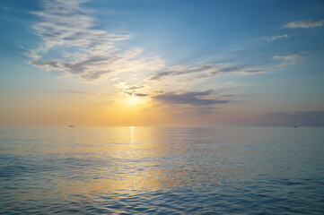 Naklejka na ściany i meble Sky background on sea shore sunset.