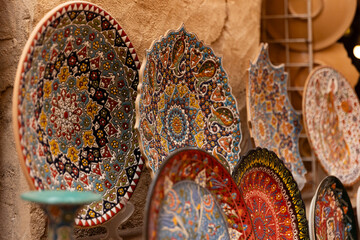 Dubai, Al Fahidi, April 2023 - Colorful ceramic tableware with historical oriental pattern. Item...