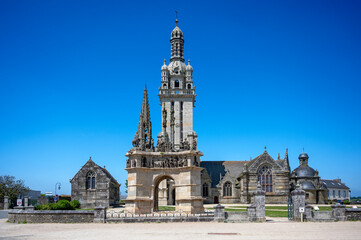 historic parish enclosure with church, ossuary and triumphator in the village of Pleyben in Brittany, France - obrazy, fototapety, plakaty