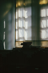 interior of a church with light shinning trough the window