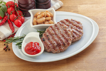 Grilled beef burger cutlet with sauce