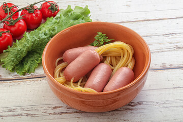 Mini sausages with pasta spaghetti