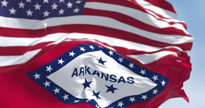 Arkansas and the US flags waving in the wind