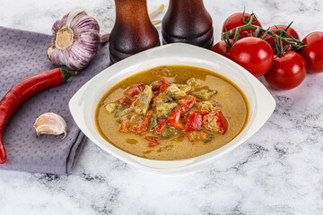 Traditional yellow Thai curry with chicken