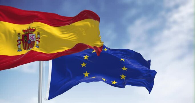 Seamless loop in slow motion of Spain and the European Union flags waving