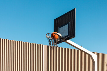 Ball in basketball hoop / Scoring the winning points at a basketball game