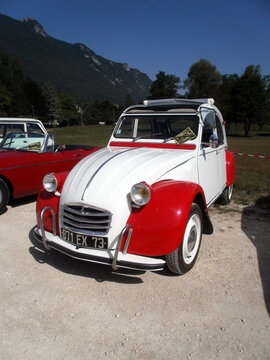 Le Bourget du lac, France - August 19th 2012 : Public exhibition of classic cars. Focus on a red and white Citroën 2CV.