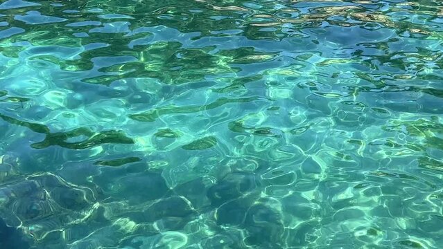 Sea water ocean clear waves blue turquoise lagoon paradise beach transparent shiny surface.