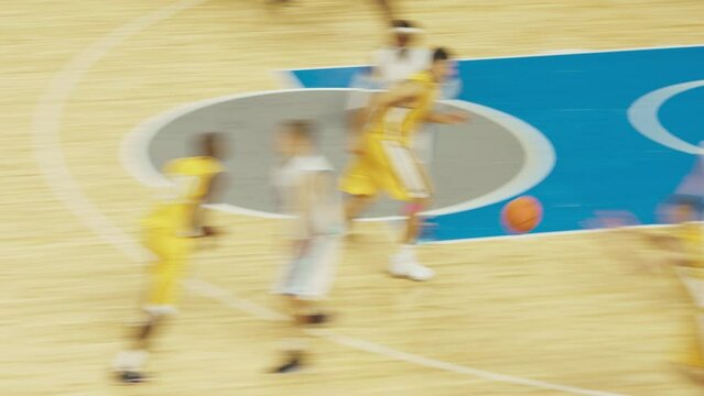 College Basketball Tournament TV Playback: Two Young Successful Diverse Teams Play a Championship Match in a Modern Arena. Excited African Player Scores a Slam Dunk with One Hand and Celebrates