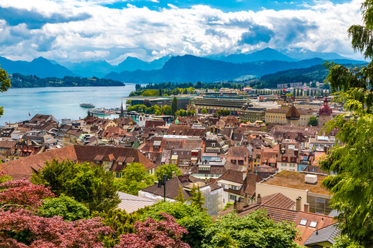 Nice view of Lucerne's Old Town at the lake Vierwaldst&auml;ttersee with the piers, the train station and the Culture and Congress Centre, embedded with a mountainous panorama in the back.