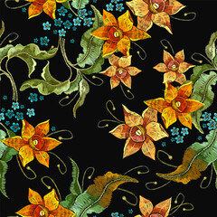 Embroidery yellow narcissuses flowers, fashion floral seamless pattern. Beautiful spring daffodils on black background. Botanical vector illustration. Template for clothes, textiles, t-shirt design