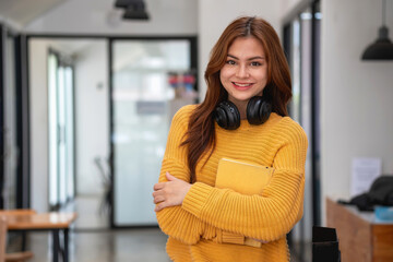 Happy latin girl college student watching distance online learning class, remote university webinar or having talk on laptop video call and use notebook to virtual meeting seminar at home or campus