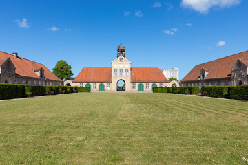 Gatehouse with clocktower and farm buildings at Augustenborg Palace, Als, Denmark