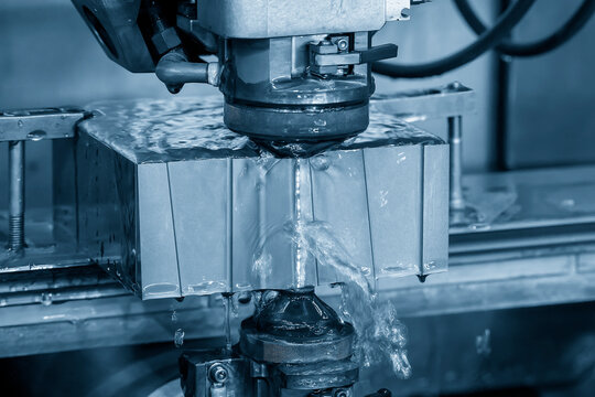 Closeup scene the wire EDM machine cutting the mold insert parts.