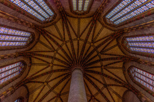 The Church of the Jacobins, a 13th century church, the interior, stained glass windows and view to the ceiling, the palm tree patterns of the roof.