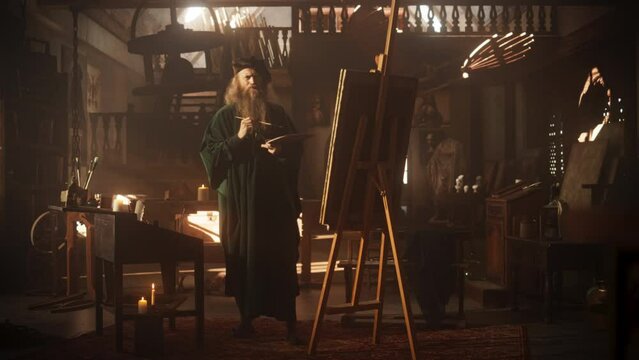 Zoom in on an Old Male Renaissance Artist Painting on Canvas in his Antique Workshop. Talented Historical Figure Working on his Next Masterpiece and Feeling Inspired While Transfering Ideas on Canvas