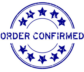 Grunge blue order confirmed word with star icon round rubber seal stamp on white background
