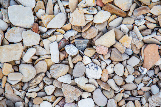 Pebbles stones on the beach abstract background 