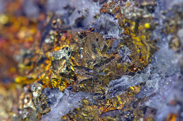 Golden background. Gold. Ore close-up. Nugget. Nugget close-up background. Crystals.