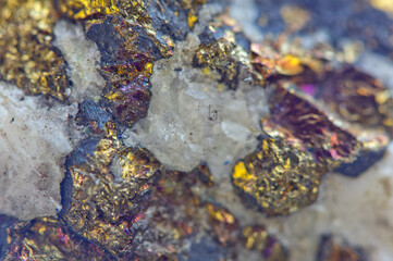 Golden background. Gold. Ore close-up. Nugget. Nugget close-up background. Crystals.