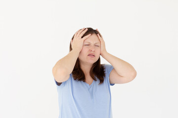 Fototapeta premium Exhausted pregnant woman touching her head with eyes closed. Female exchange worker suffering from unbearable headache. Health concept