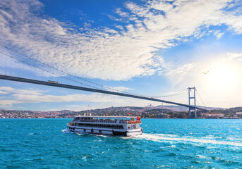 Ship is sailing near the Bosphorus bridge and modern Istanbul view, Turkey
