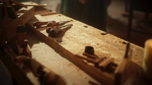 Zoom in Close up of Wooden Antique Workshop Table and Tools for Woodwork. Creative Space for Fine Art Creator and Sculptor, Witnessing Talent and Inspiration. Old Traditional Wood Carving Tools