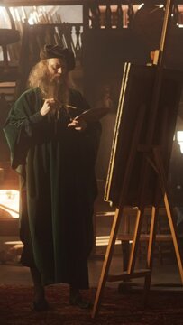 Vertical Screen: Representation of Historical Era: Portrait of the Genius Leonardo Da Vinci Painting and Creating a Masterpiece in his Art Workshop. Talented Renaissance Painter Practicing his Craft