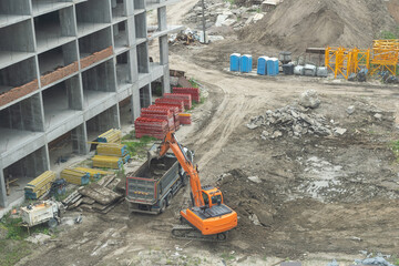 Aerial view Hydraulic scissors on rigging to cut abandoned buildings destroy building, Hydraulic...