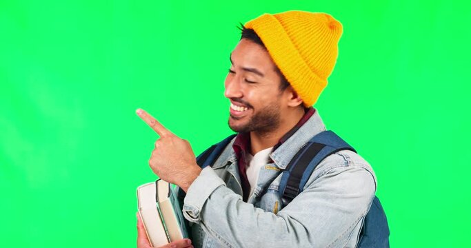 Pointing, student books and man on green screen for university, college or education presentation. Information, registration steps and happy face of a college person in backpack on studio background