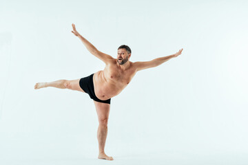 multiethnic men posing for a male edition body positive beauty set showing messages on banners....