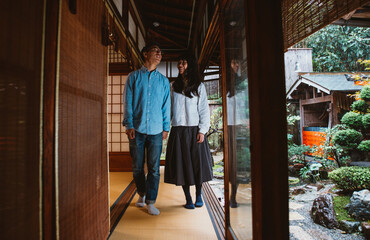Fototapeta premium Young japanese couple spending time in their house