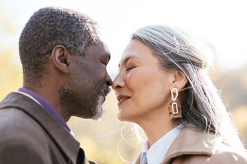 Storytelling image of a multiethnic senior couple in love
