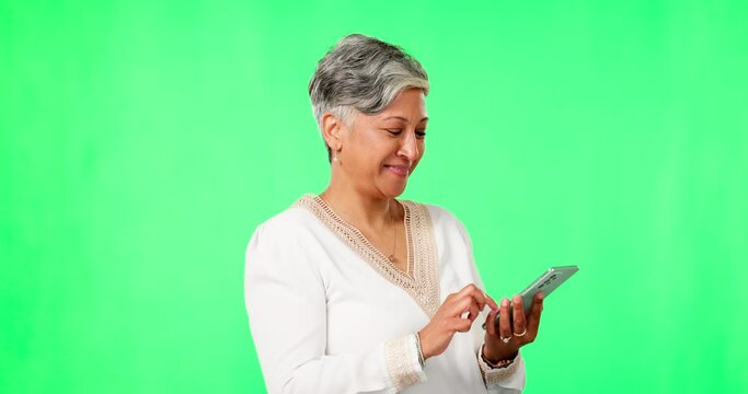 Phone, funny and senior woman on green screen in studio isolated on a background mockup. Mobile, elderly person and laughing at meme, comedy or joke, internet or social media, scroll on app and email