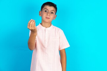Little hispanic boy wearing white shirt  Doing Italian gesture with hand and fingers confident expression
