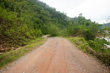 Fototapeta na wymiar Highway from the City of Tarapoto to the town of Chazuta in the Peruvian jungle. Bad road due to rain.
