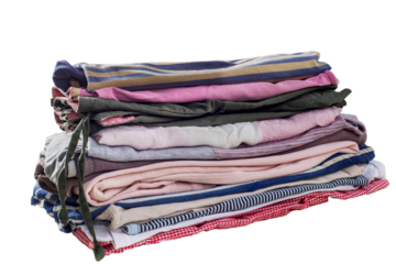 Stack of used clothes. Organizing the wardrobe. Sustainable living concept, sorting second hand for recycling