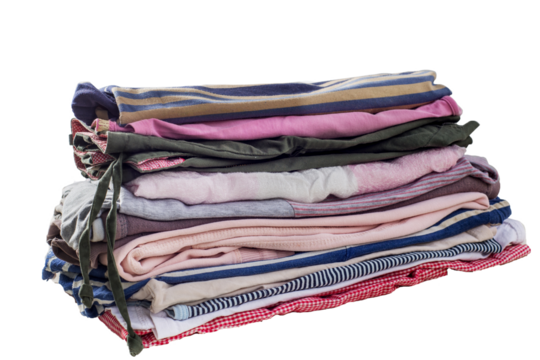 Stack of used clothes. Organizing the wardrobe. Sustainable living concept, sorting second hand for recycling